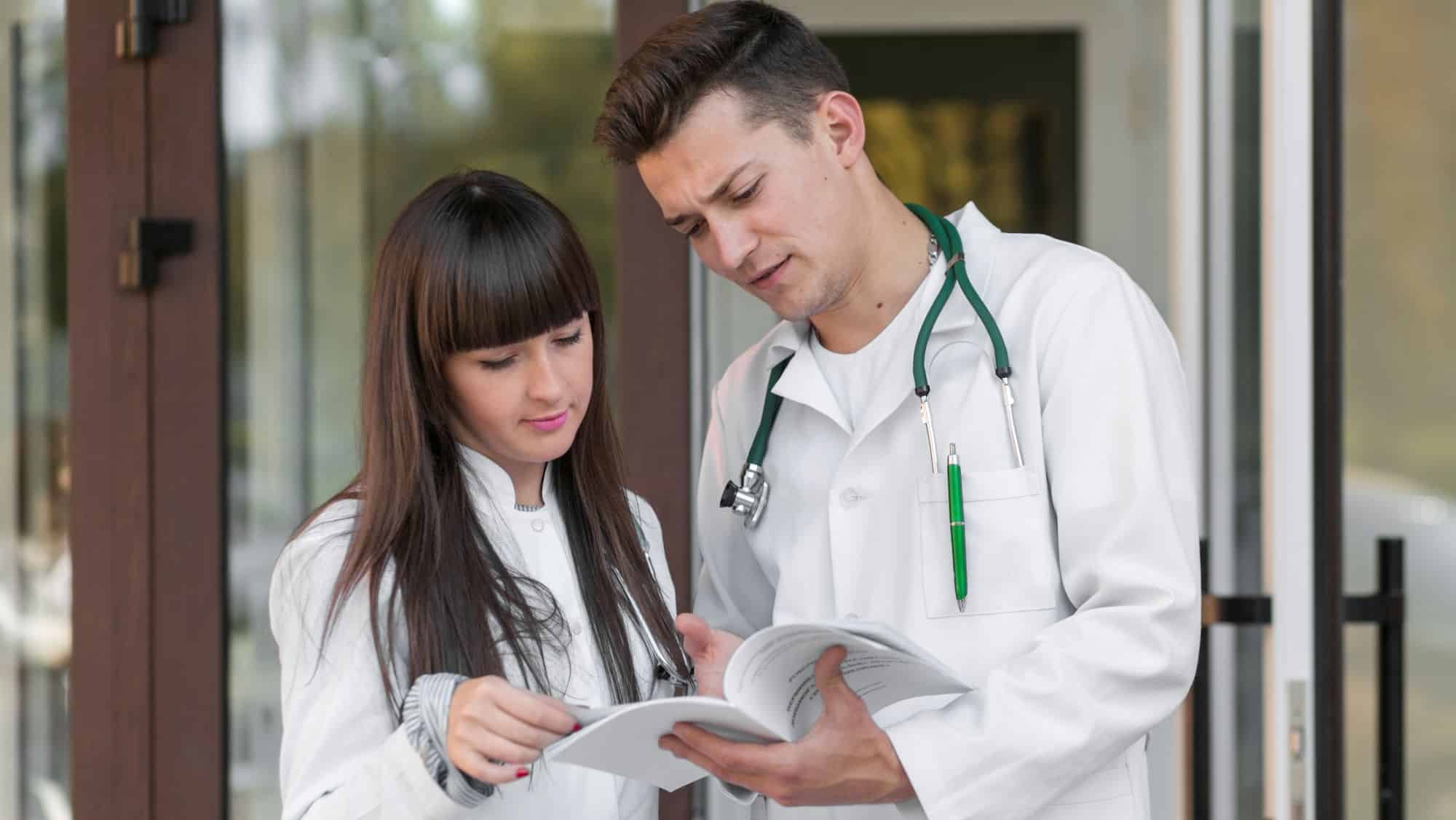 medics-standing-reading-papers-hospital Medical Relationship